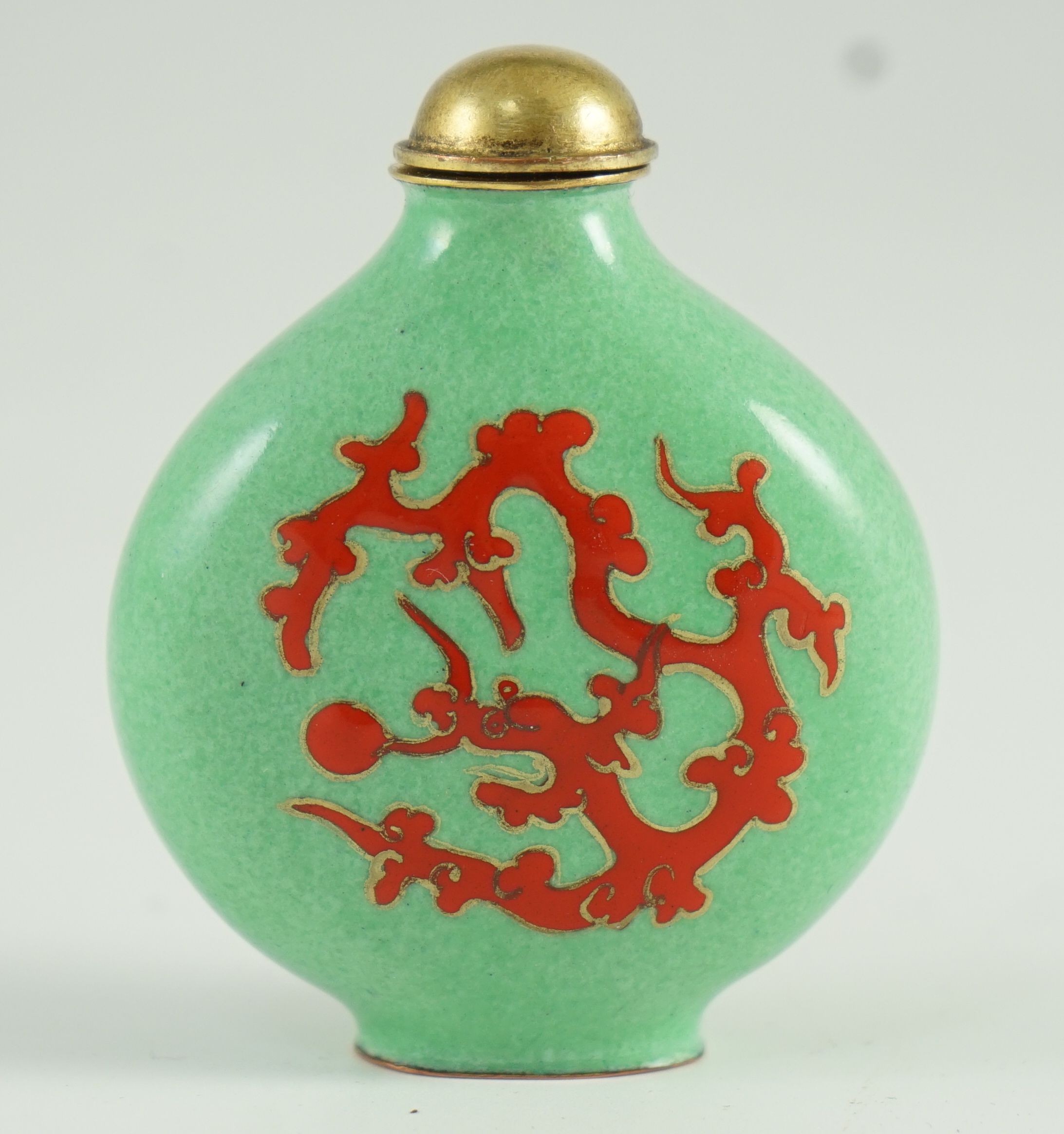 A Chinese enamel on copper green ground snuff bottle, 19th/20th century, 6.2 cm high including stopper